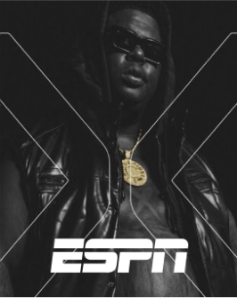 A black and white photo of UnitedMasters Partner Artist BigXThaPlug in a black leather hoodie with a white ESPN logo